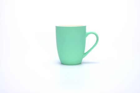 colorful coffee mug isolated on white backgroundの写真素材