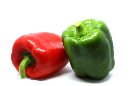 red and green bell pepper isolated on white backgroundの写真素材