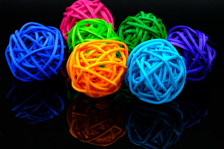 colorful rattan ball for decoration on black backgroundの写真素材