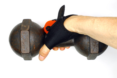 a senior asian man (depicts part of his arm) working out with a dumbbell, isolated on white backgroundの写真素材