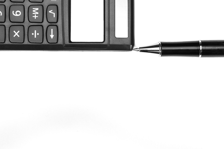 a calculator and a fountain pen, isolated on white backgroundの写真素材