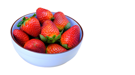 a bunch of large strawberries on a blue ceramic bowl,  isolated on white background, copy spaceの写真素材