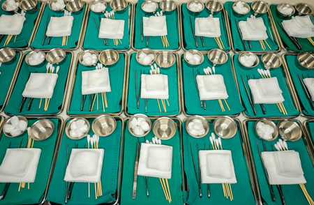preparing minor surgical dressing sets for sterilization by autoclavingの写真素材