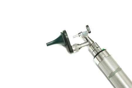 a stainless steel otoscope, an important tool used by a otolaryngologist, or an ear doctor, to examime a patient's ear, isolated on white backgrown, closeup viewの写真素材