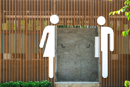 male and female icons in front of an entrance of a public toilet, simple, modern, and functional
