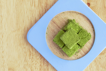 White chocolate fudge heavily coated with fine green tea powder.の写真素材