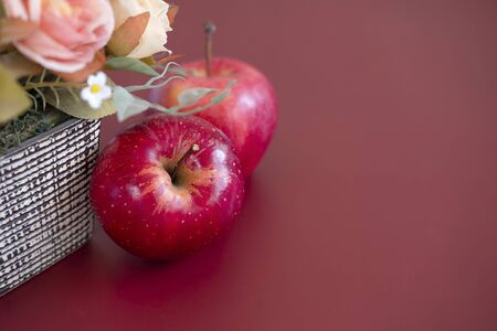 Two red gala apples on mahoganyの写真素材