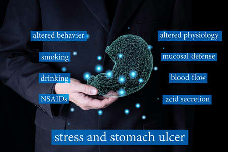 A businessman holding a wire frame model of a stomach with text describing causes of stress and...