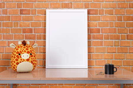 3d rendered picture frame mock up with stuffed toy animal.の写真素材
