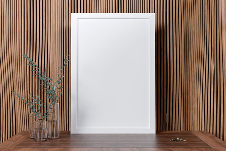3d rendered illustration of a mock up picture frame and a flower vase.の写真素材