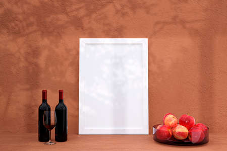 A mockup picture frame with wine bottles on a shelf. 3d rendered illustration.の写真素材