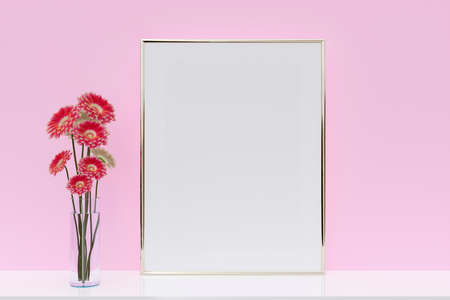 A mockup picture frame with flower vase on pink wall background. 3d rendered illustration.