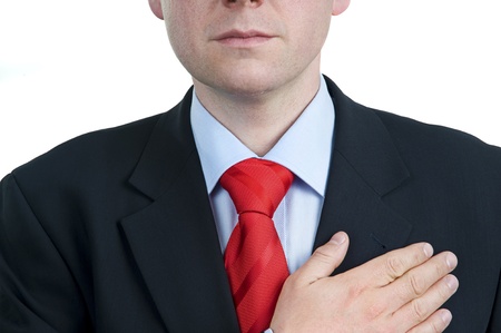 Man keeping hand on heart isolated on whiteの写真素材