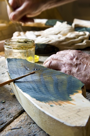 Artist paints a sculpture
