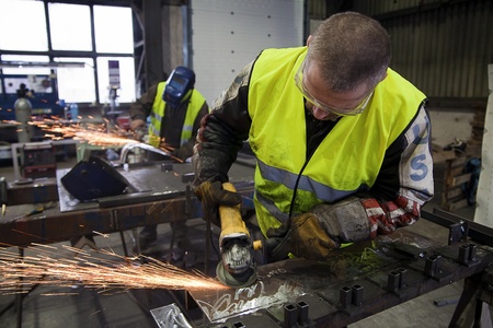 Manufactory - Two Men using Grindersのeditorial素材