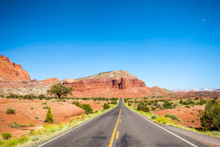 Straight road through empty wilderness in Utah, USAの写真素材