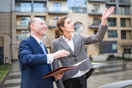 Real estate agent presenting new apartmentの写真素材