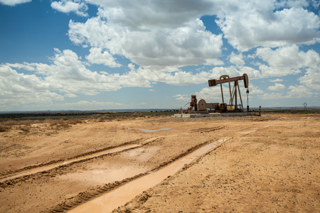 Tire prints leading to oil pump jackの写真素材