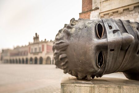 Art monument in the market square of old city Krakow Poland