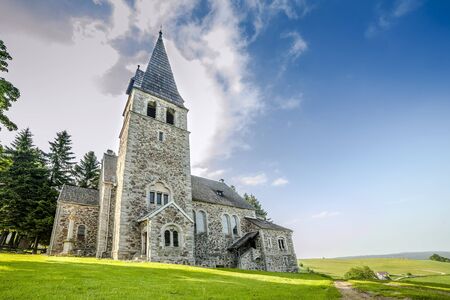 Stone church after storm, before sunset in vivid colorsの写真素材