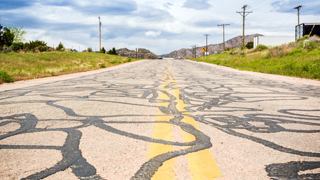 Driving coutryside on the road what was repaired plenty of timesの写真素材