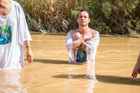 Jericho, Israel - November 2, 2015: Organised baptism for group of pilgrims in river of Jordan, the...