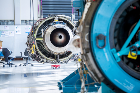 Engine's maintenance in huge industrial hall .