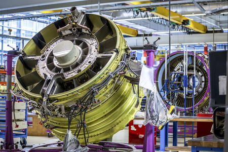 An airplane engine during maintenance in a warehouseの写真素材