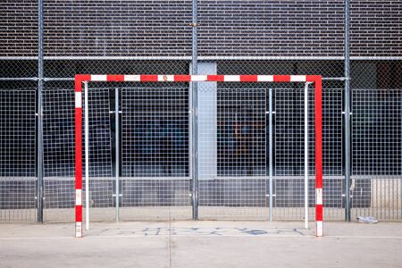 Goal post on urban football field, soccer pitchの写真素材