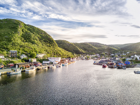 Charming Petty Harbour with green hills and colorful wooden architecture, Newfoundland, Canadaのeditorial素材