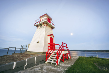 Wooden lighthouse in white and red next to Fort Amherst, Newfoundland, Canadaの写真素材