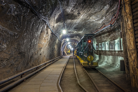 Yellow passenger underground train used in an old salt mine to transport touristsのeditorial素材