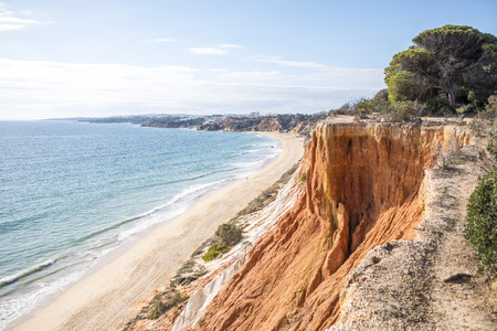 Beutiful cliffs along Falesia Beach and The Atlantic Ocean in Albufeira, Algarve, Portugalの写真素材