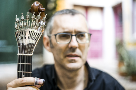 Musician with his beloved  portuguese guitar on the street of Lisbon, Portugal