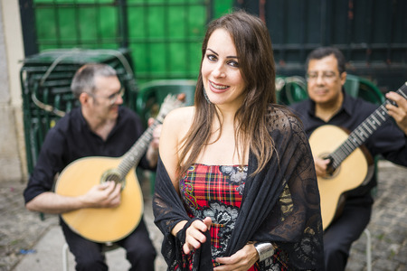 Fado band performing traditional portuguese music on the square of Alfama, Lisbon, Portugal