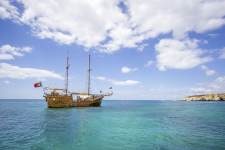Pirates boat for tourists sailing along coast in Algarve, Portugalの写真素材