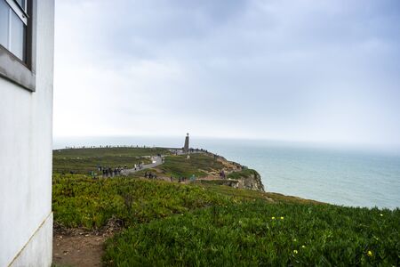 The most western part of Europe with cross monument by Atlantic ocean, Cabo da Roca, Portugalの写真素材