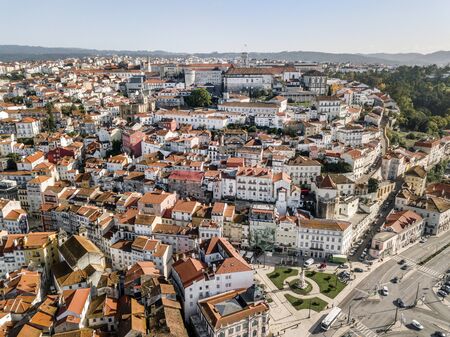 Aerial view of city center of historic Coimbra during sunny day, Portugalの写真素材