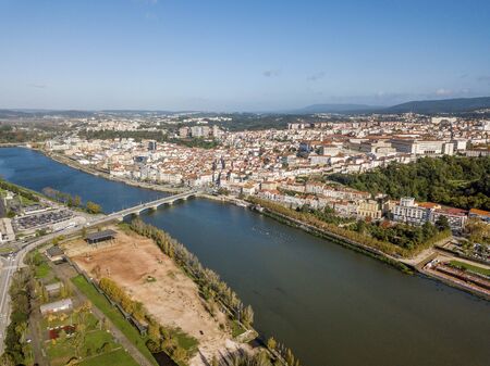 Aerial view of city center of historic Coimbra during sunny day, Portugalの写真素材