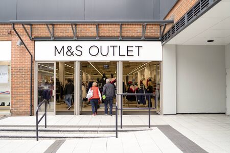 Portsmouth, Great Britain - November 3, 2019: Entrance to M&S Outlet in modern shopping mallのeditorial素材