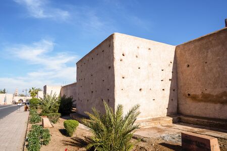 Old massive Marrakech city walls surrounding old town called medinaの写真素材