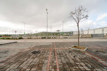 Faro, Portugal - April 7, 2020: Empty parking lot in front of the biggest shopping mall in Algarve - MAR Shopping Mall, Designer Outlet and Ikea - due to emergency state caused by coronavirus pandemicのeditorial素材