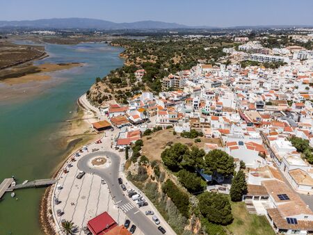Aerial view of Atlantic bay and city of Alvor, Algarve, Portugalの写真素材