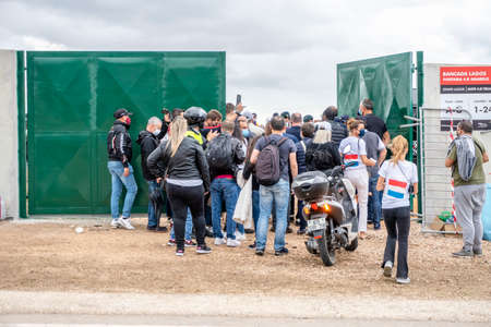 Portimao, Portugal - October 25, 2020: Crowd entering Formula 1 championship through green gate of a racetrackのeditorial素材
