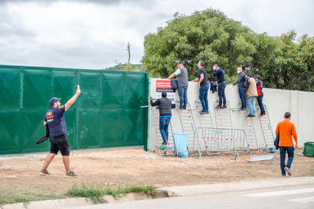 Portimao, Portugal - October 25, 2020: People watching Formula 1 championship through the fence....