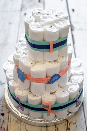 Diapers cake decorated with ribbons for a baby boyの写真素材