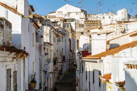 Narrow street between whitewash houses of fortified Elvas, Alentejo, Portugalの写真素材