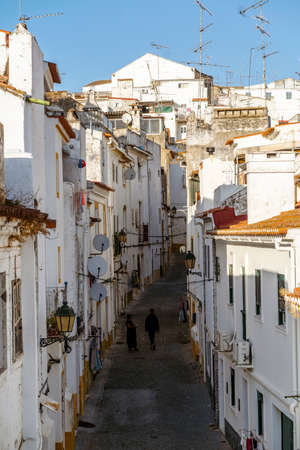 Narrow street between whitewash houses of fortified Elvas, Alentejo, Portugalの写真素材