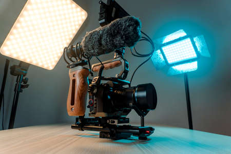 Full frame camera with external monitor, mic, and handheld film-making rig.の写真素材