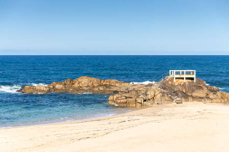 Small pier on the rocks in Vila do Conde, Porto, Portugalの写真素材